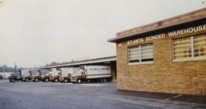 Colonial Cartage trucks parked at dock doors - 1500 Southland Circle